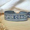 Bracelet cavalière tissu "Super Coach"
